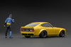 (Pre-Order) 1/18 Ignition Model IG3109 Nissan Fairlady Z (S30) Star Road Yellow Metallic w/ Mr. Inoue